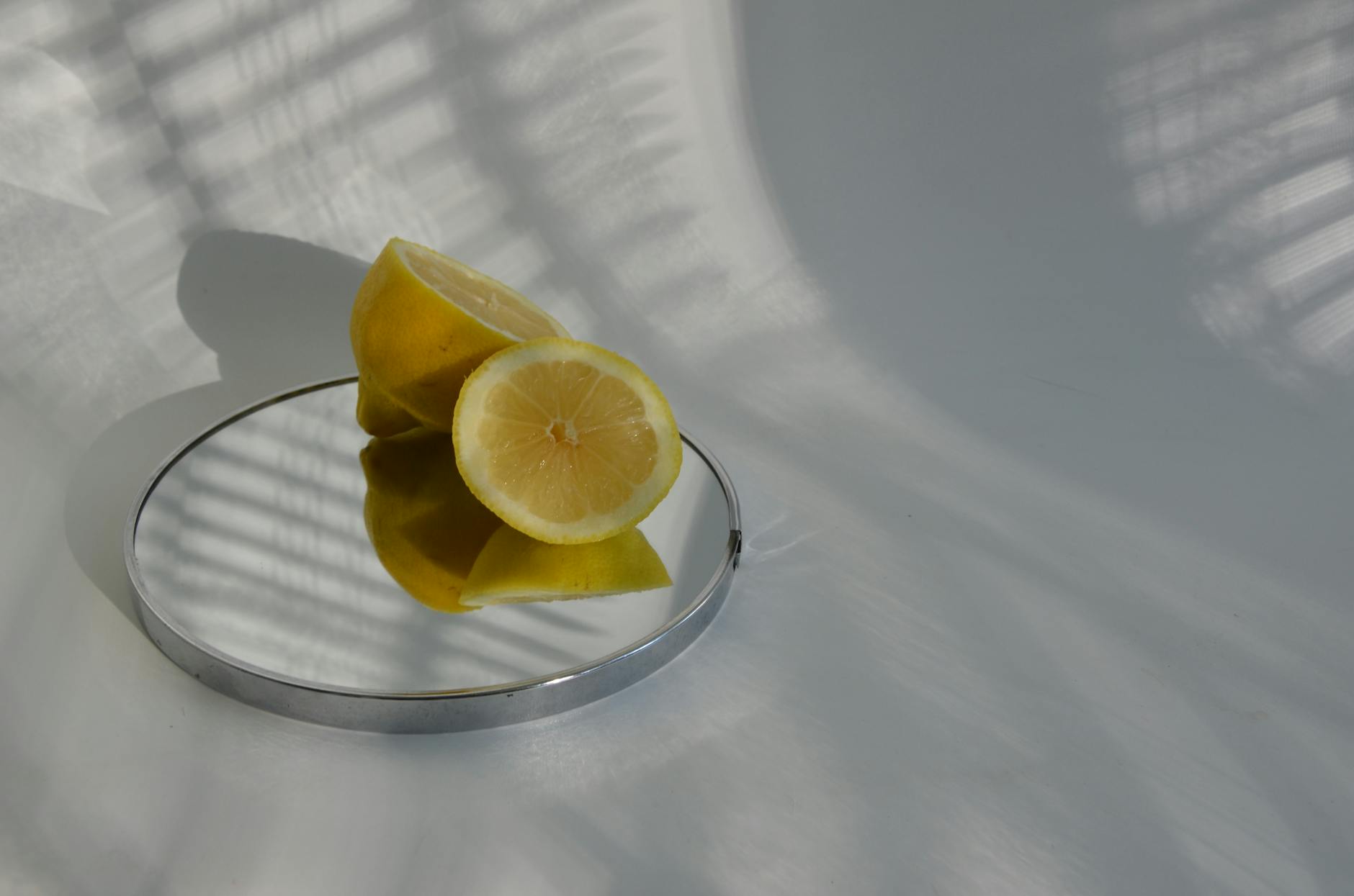Yellow silicone vibrator surrounded by peeled bananas on a yellow background